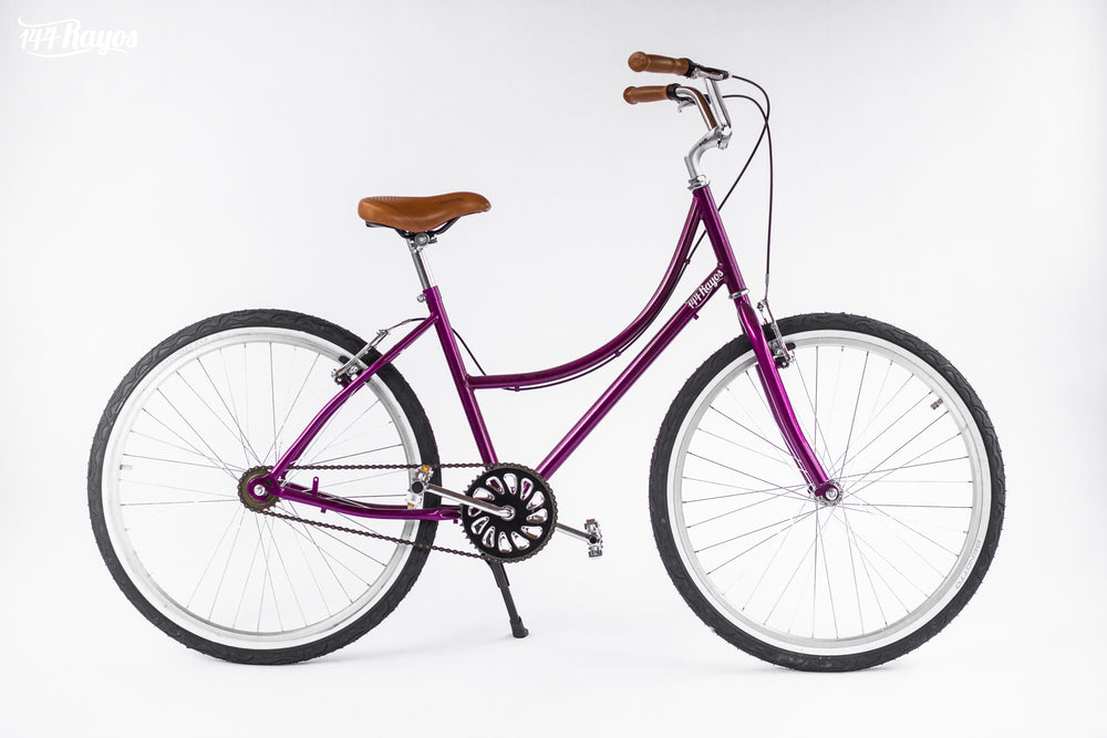 Bicicleta Colibrí S/A morada de 144 Rayos, vista lateral sobre fondo claro